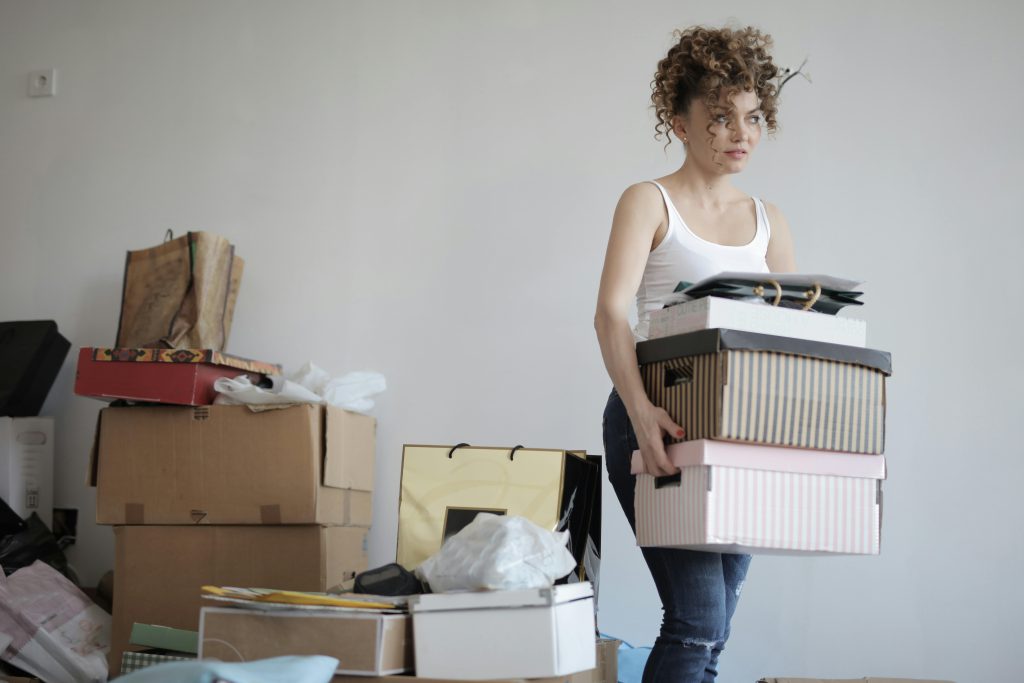 Woman carrying moving boxes - visit rsd-storage.com.