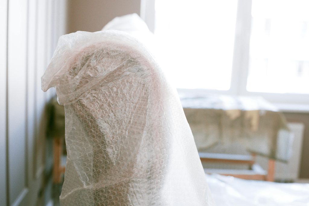 Upper section of an armchair wrapped in bubble wrap - Visit RSD-Storage.com. 